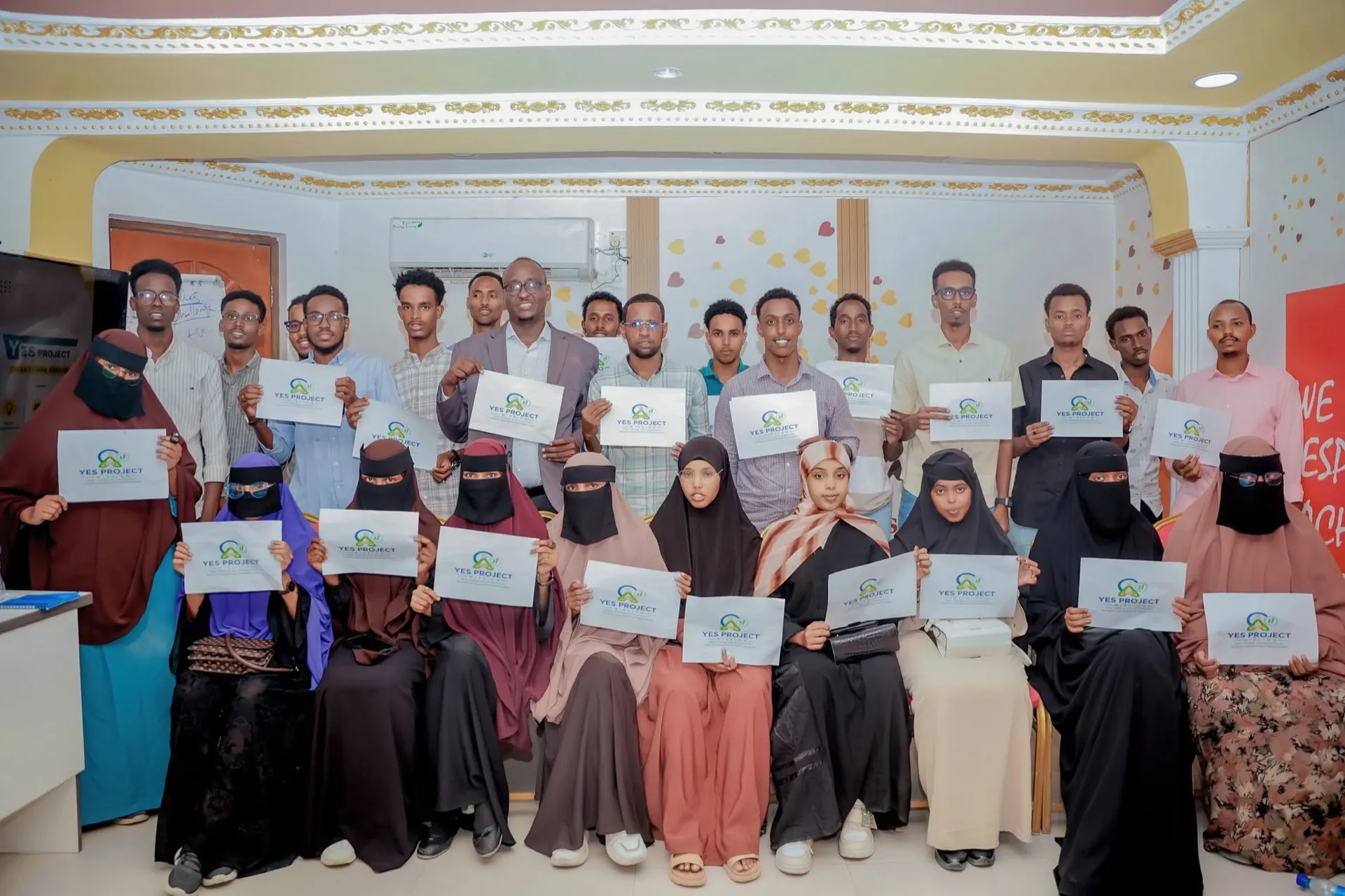 Graduates holding YES Project certificates
