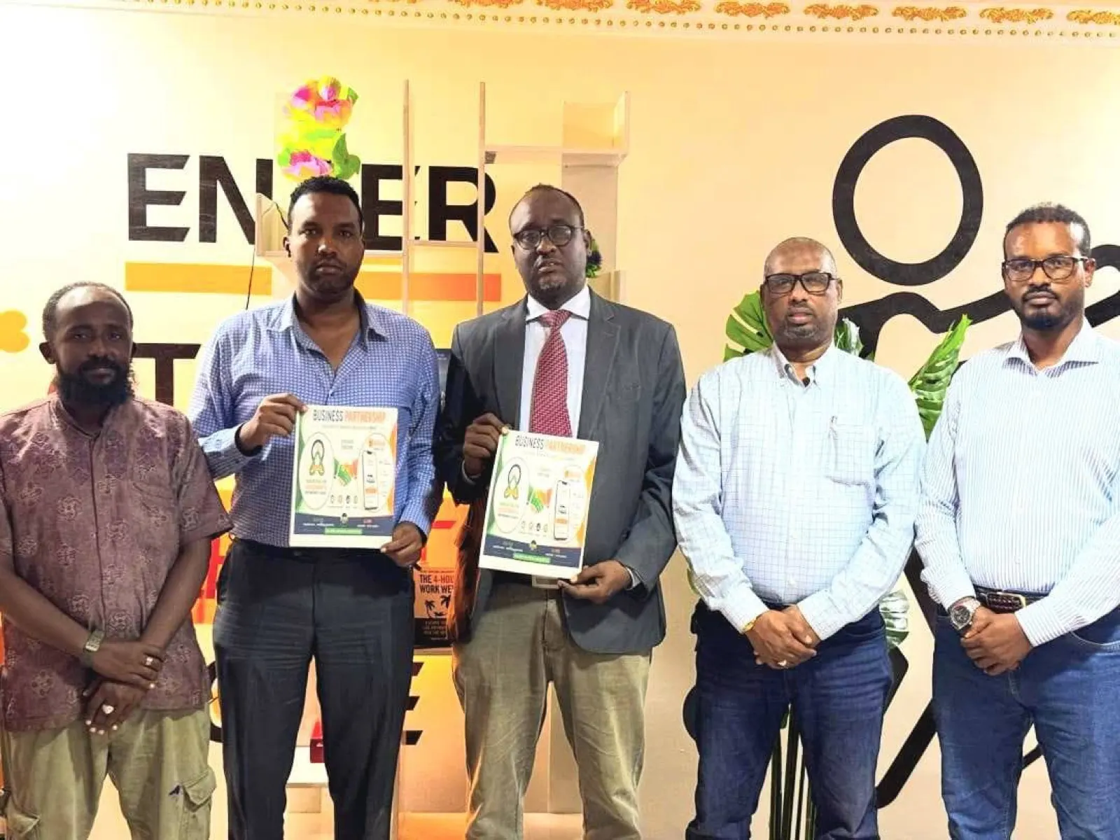 IDEA representatives signing a business partnership agreement